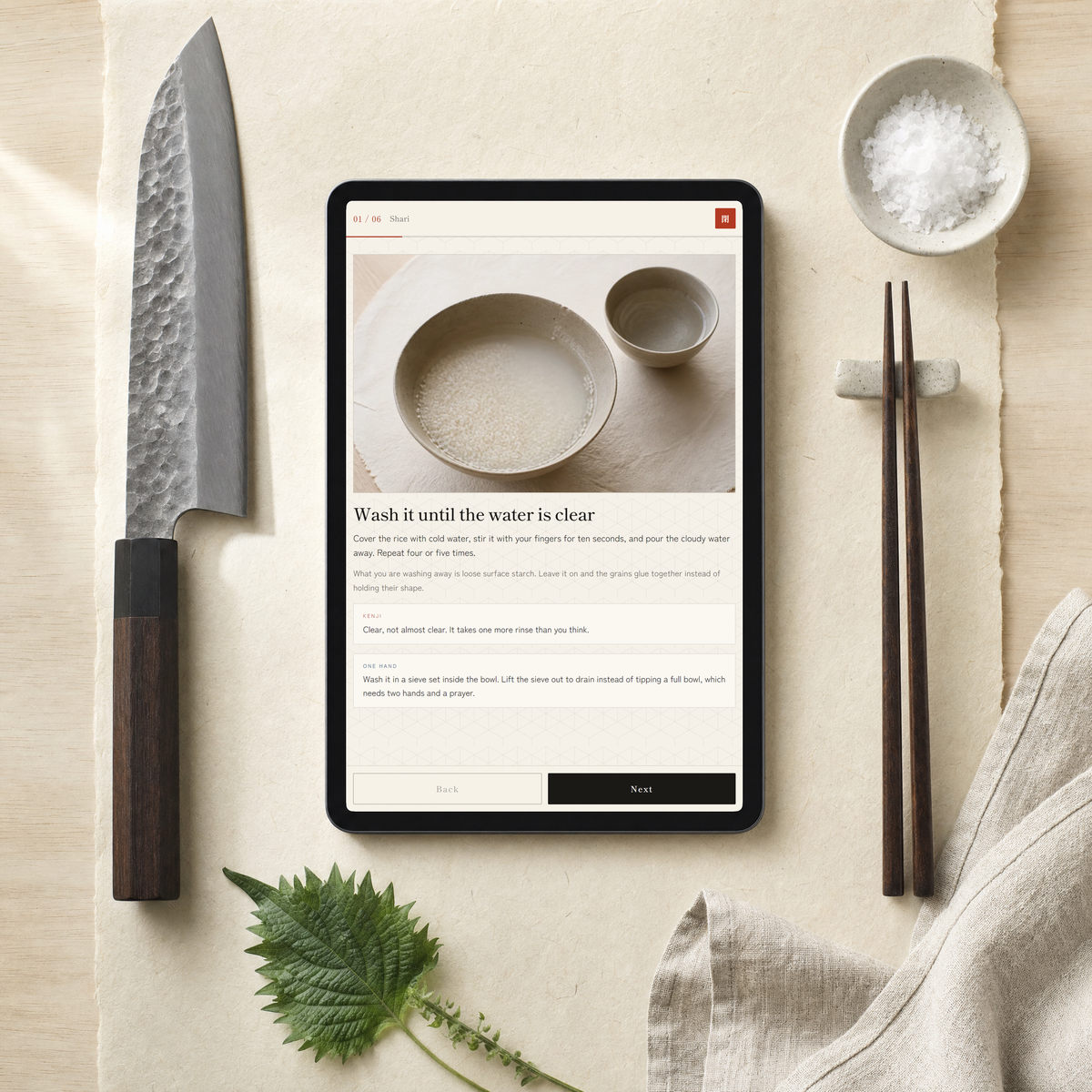 A recipe open on a tablet, photographed from above on washi paper