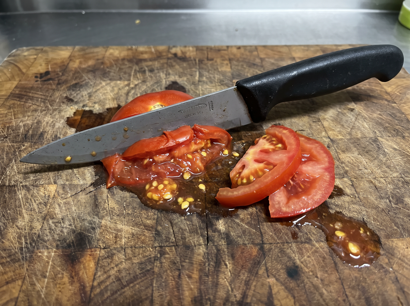 A tomato crushed by a dull knife