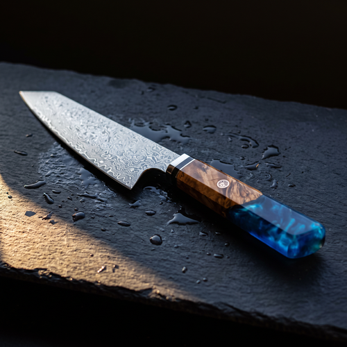 The Kenji 8 inch damascus chef's knife on wet slate