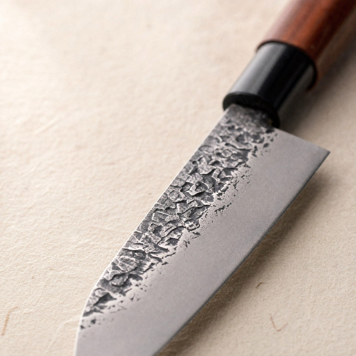 The hammered face of the santoku blade