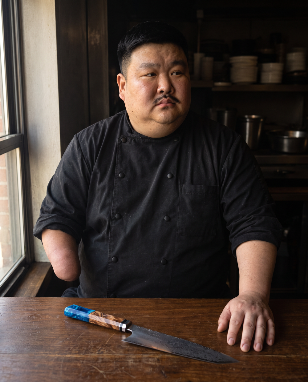 Kenji behind his counter