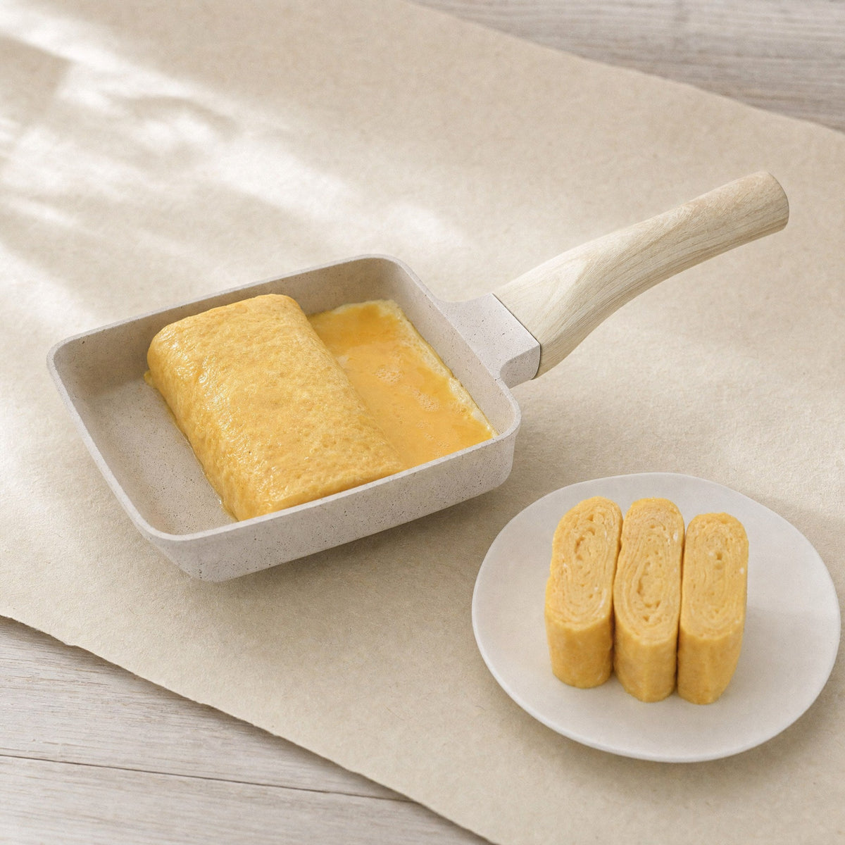 A tamagoyaki part rolled in the pan
